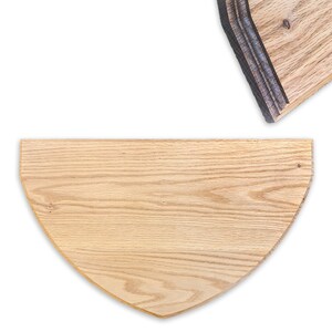 May include: Two wooden, semi-circular shelves with a natural wood grain finish. The shelves are light brown and have a smooth surface. One shelf is positioned below the other, with a white background.