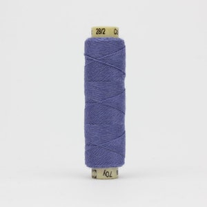 May include: A spool of purple thread with the text "28/2" and "10Y" printed on the label.