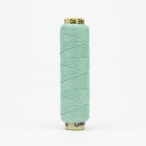 May include: A spool of light green thread with the text "Col. EN19" on the label.