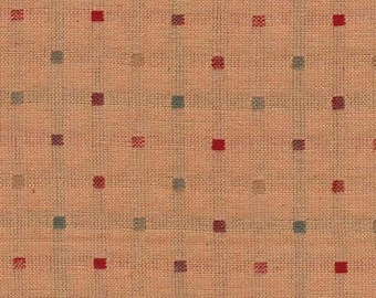 May include: A beige fabric with a repeating pattern of small red and blue squares.
