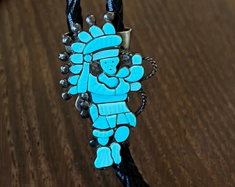 Silver and turquoise bolo - man in regalia shape