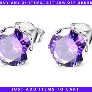 May include: A pair of silver stud earrings with a large, round, purple gemstone in the center of each earring.