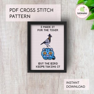 May include: A framed cross-stitch pattern with the text "I MADE IT FOR THE TIGER" above a bird and a blue tiger, and "BUT THE BIRD KEEPS TAKING IT" below. The words "PDF CROSS STITCH PATTERN" and "INSTANT DOWNLOAD" are also visible.