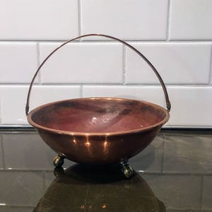 Hammered Copper bowl with handle and brass feet
