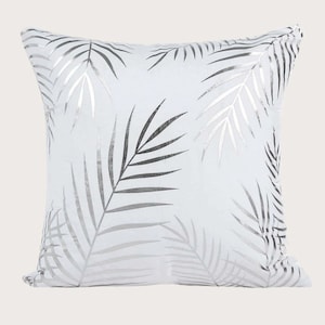 White cushion cover with silver leaf print