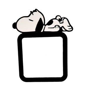May include: Black and white illustration of a cartoon dog laying down on top of a black square frame.