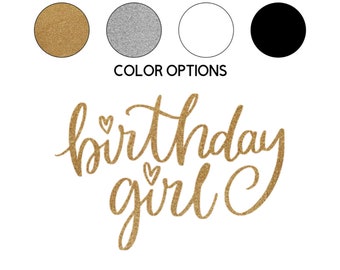 May include: Gold glitter birthday girl text with hearts.  The text is in a cursive font.  The background is white.