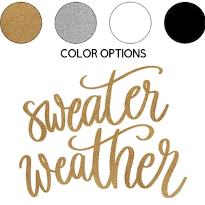 May include: Gold glitter vinyl decal with the text "sweater weather" in a cursive font.