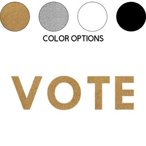 May include: Gold glitter VOTE sign with colour options for gold, silver, white, and black.