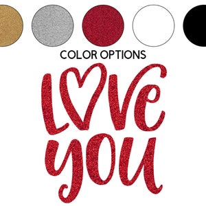 May include: Red glitter lettering that says "Love You" with a heart in the middle of the word "Love".