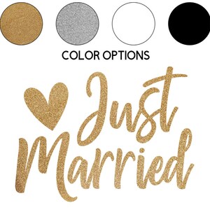 May include: Gold glitter heart and the words "Just Married" in gold glitter lettering.