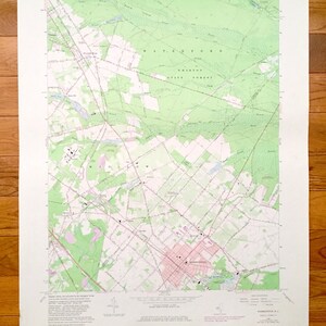 May include: A vintage map of the Waterford, Connecticut area. The map shows roads, rivers, and other geographical features. The map is printed in black and white with green and pink accents. The map is titled "Waterford, Connecticut" and includes the text "United States Department of the Interior Geological Survey".
