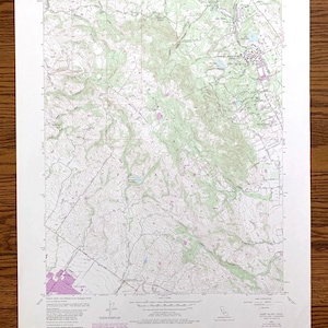 May include: A vintage topographic map of the Glen Ellen Quadrangle, California, showing the area around the town of Glen Ellen. The map is printed on paper and has a light green and pink color scheme. The map includes contour lines, roads, and other features.