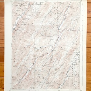 May include: A vintage topographic map of the Germany Settlement and surrounding areas in West Virginia. The map shows the location of roads, rivers, mountains, and other geographical features. The map is printed in black and white on a cream-coloured paper.
