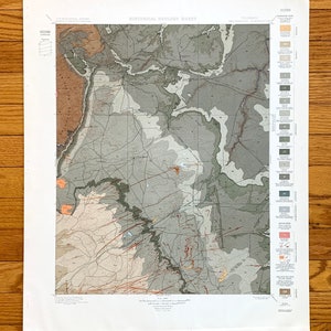 May include: A historical geology sheet map of the Walsenburg Quadrangle in Colorado. The map shows the geological formations and features of the area, including the Sangre de Cristo Mountains. The map is printed in black and white with colored lines and symbols to indicate different geological features.