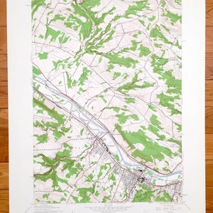 May include: A vintage topographic map of the United States Geological Survey, showing the area around the town of Bridgeport, Connecticut. The map features contour lines, rivers, roads, and other geographical features. The map is printed on paper and has a light brown colour.
