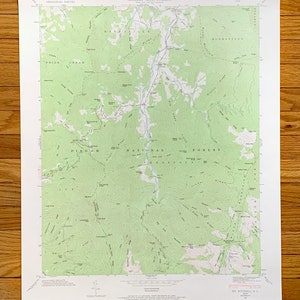 May include: A vintage topographic map of the My Mitchell Quadrangle in North Carolina, showing the Pisgah National Forest and the surrounding area. The map is printed in green and brown on white paper and includes contour lines, rivers, and other geographical features.