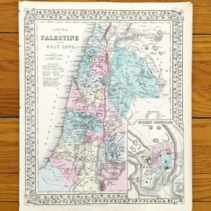 May include: A detailed vintage map of Palestine, labelled "Holy Land", with an ornate border. The map includes a smaller inset map of Jerusalem and uses a variety of colours to distinguish regions. The map is printed on aged paper.