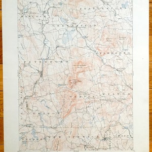 May include: A vintage topographic map of New Hampshire, showing the towns of Bennington, Hancock, Greenfield, Lyndeboro, Peterborough, Temple, Wilton, Sharon, Windsor, New Ipswich, Mason, and the surrounding area. The map is printed in black and white on a cream-colored paper.