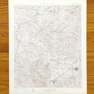 May include: A vintage paper topographic sheet map of the Columbia, Tennessee area, featuring detailed contour lines, drainage patterns, and geographic labels printed in black and brown ink on a white background with a clear title at the top.