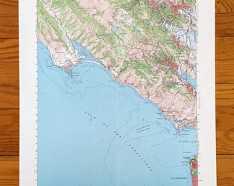 May include: A detailed topographic map of the San Francisco Bay Area, featuring the Gulf of the Farallones and San Francisco. The map uses a color-coded system to represent elevation and geographical features. The map is printed on white paper.