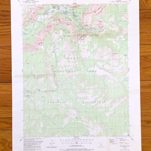 May include: A detailed topographic map of Yosemite National Park and Yosemite Wilderness, featuring contour lines, elevations, and geographical features. The map is printed on white paper and includes text indicating the map's scale and source.