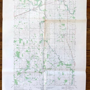 May include: A vintage topographic map of the Foreston Quadrangle, Minnesota, published by the United States Geological Survey. The map shows the area's terrain, rivers, roads, and other features. The map is printed on a white background with green and brown lines.