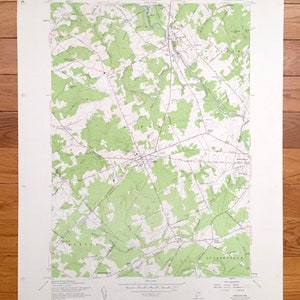 May include: A vintage topographic map of Scarborough, Maine, showing roads, rivers, and elevation contours. The map is printed on white paper with green and brown ink. The map is titled "Scarborough, Maine" and includes a scale bar and compass rose.