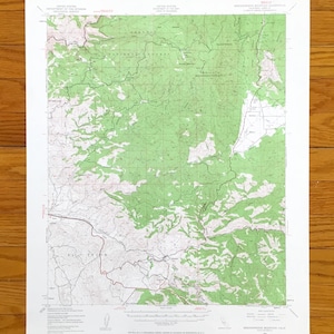 May include: A topographic map of the Brookside Mountain, California area, featuring green and white shaded relief. The map includes contour lines, roads, and text indicating the United States Department of the Interior and the National Forest.