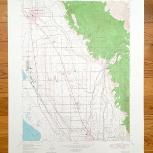 May include: A black and white topographic map of the area around the city of Orem, Utah. The map shows roads, rivers, and other features. The map is titled "Orem, Utah" and is dated 1953.