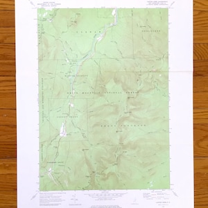 May include: A topographic map of the White Mountain National Forest, featuring contour lines, place names, and geographical features. The map is printed on white paper and includes the text "United States Department of the Interior".