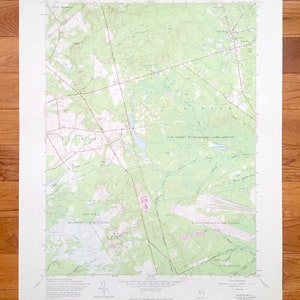 May include: A vintage topographic map of the Jackson, New Jersey area. The map shows the location of the New Jersey Wildlife and Game Refuge, Fort Dix Military Reservation, and the Lakehurst Naval Air Station. The map is printed on a white background with green and brown lines.