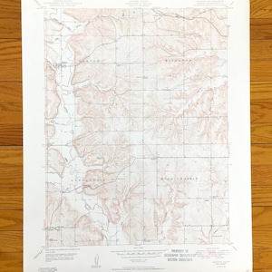 May include: A vintage topographic map with a grid pattern, featuring contour lines and place names like Alexandria and Bickford. The map is printed in shades of brown and tan on a white background. The map is from the Geography Department of Boston University.