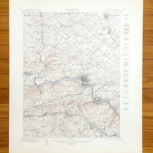 May include: A vintage topographical map with detailed contour lines, featuring place names like Plymouth and Worcester. The map uses a muted colour palette of beige, brown, and blue, with text that reads "TOPOGRAPHY" at the top. The map is printed on aged paper.