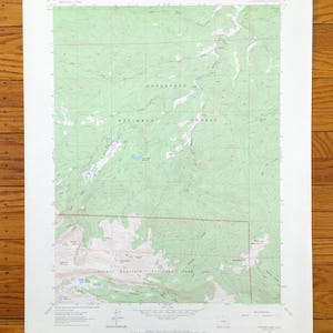 May include: A vintage topographic map of the Roosevelt National Forest in Colorado. The map shows the location of trails, roads, and other features. The map is printed on a white background with green lines and text.