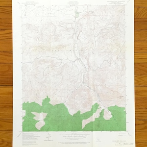 May include: A United States Geological Survey topographic map of the Eagle Rest Peak quadrangle in California. The map features detailed contour lines, elevation data, and a large green section representing the Los Padres National Forest area.