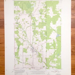 May include: A vintage topographic map of Limestone, Maine, with green shaded areas representing forests and contour lines indicating elevation changes. The map includes text from the Department of the Interior and the Geological Survey.