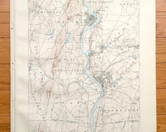 May include: A vintage map of Springfield, Massachusetts, showing the surrounding towns and rivers. The map is printed in black and white with blue and brown accents. The map is titled "Massachusetts - Connecticut, Springfield Sheet."
