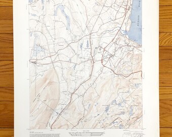 May include: Vintage topographic map of Cornwall, New York, showing roads, rivers, and elevation contours. The map is printed on paper and has a light brown color.