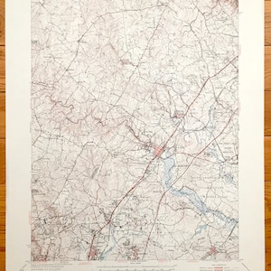 May include: A vintage topographic map of Laurel, Maryland, printed by the United States Department of the Interior Geological Survey and the United States Department of the Army. The map shows roads, rivers, and other geographical features.