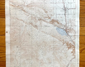 May include: A vintage topographic map of Antelope Valley, California, showing the area around Palmdale, California. The map is printed on paper and has a brown and white color scheme. The map includes contour lines, roads, and other features. The map is titled "MAP FILE L33" and is dated 1953.