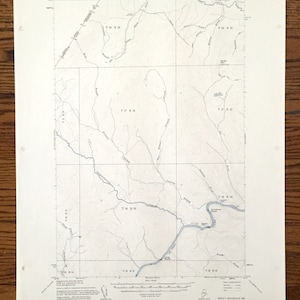May include: A black and white topographic map of Rocky Mountain, Maine. The map shows the location of the Rocky Mountain Quadrangle, which is located in the state of Maine. The map also shows the location of the towns of Rocky Mountain, Maine, and the surrounding area.