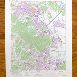 May include: A vintage topographic map of Novato, California, showing roads, rivers, and elevation contours. The map is printed on white paper with green and pink lines and text. The map is titled "Novato Quadrangle, California" and includes a scale bar and compass rose.
