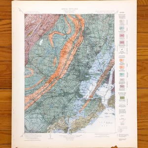 May include: A vintage map titled "Areal Geology" of New Jersey and New York, with detailed geological information. The map uses colours such as orange, green, and blue to represent different geological formations. A legend is present on the right side of the map.