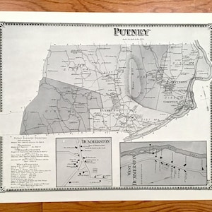 May include: A vintage map print of Putney, Vermont, featuring detailed cartography in black and white. The print includes smaller maps of Dummerston and West Dummerston, along with a Putney Business Directory. The map is framed with a decorative border.