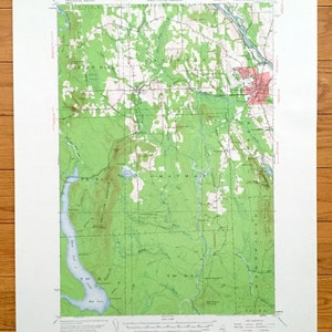 May include: A vintage topographic map of the Chapman, Maine area. The map shows the location of roads, rivers, lakes, and other geographical features. The map is printed in black, green, and brown on white paper. The map is titled "Chapman, Maine" and includes the text "United States Department of the Interior Geological Survey" and "State of Maine Represented by the Public Utilities Commission".