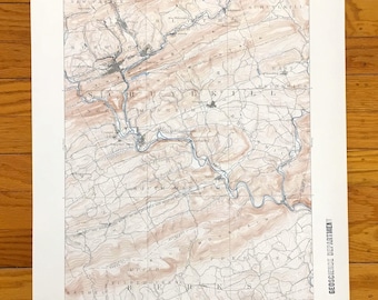 May include: A vintage topographic map of Pennsylvania, showing contour lines, rivers, and place names. Printed in brown and blue, it includes text indicating the United States Department of the Interior and the Geoscience Department.