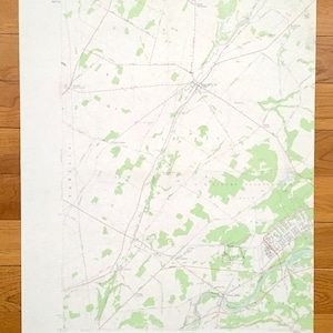 May include: A vintage topographic map of the Black River quadrangle in New York State. The map shows roads, rivers, and other geographical features. The map is printed on white paper with green and brown ink.