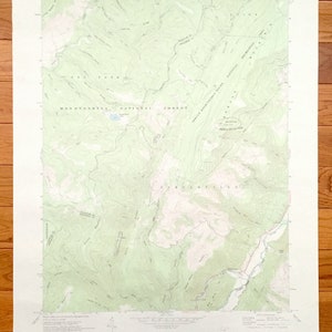 May include: A vintage topographic map of the Monongahela National Forest in West Virginia. The map shows the location of trails, roads, and other features. The map is printed on a light green background with brown lines and text.