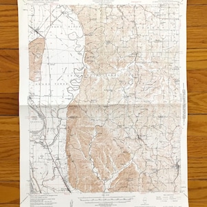 May include: A 1947 United States Geological Survey topographic map of the Alto Pass Quadrangle in Illinois. The paper map features detailed contour lines, river paths, and geographic labels printed in black and brown ink on a white background.